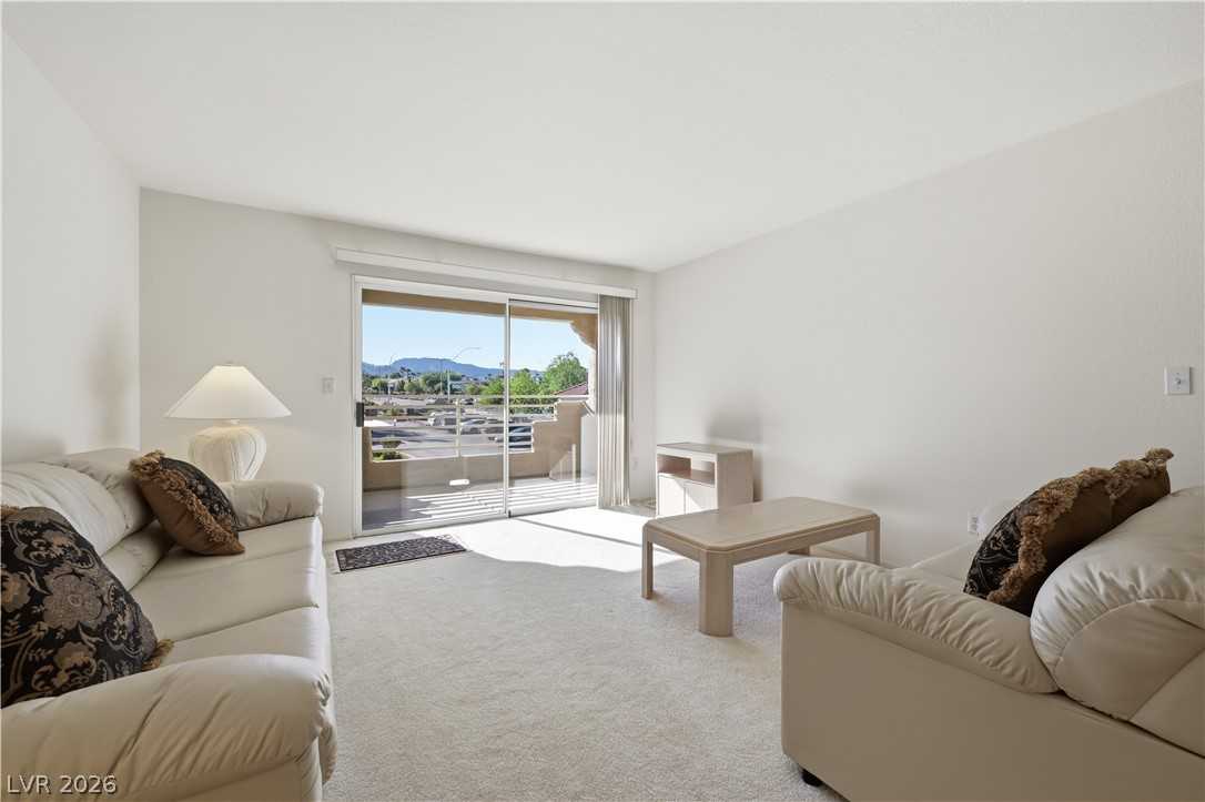 Living room with balcony slider at 1908 Rio Canyon Court #206