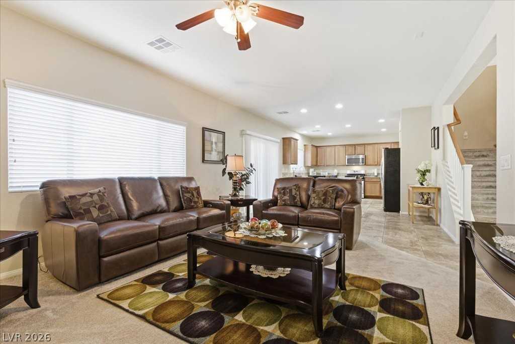Family room with ceiling fan at 3413 Pelican Brief Lane