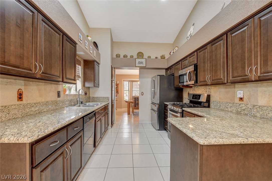 Kitchen with granite counters and wood cabinets at 5020 Pacific Grove Drive