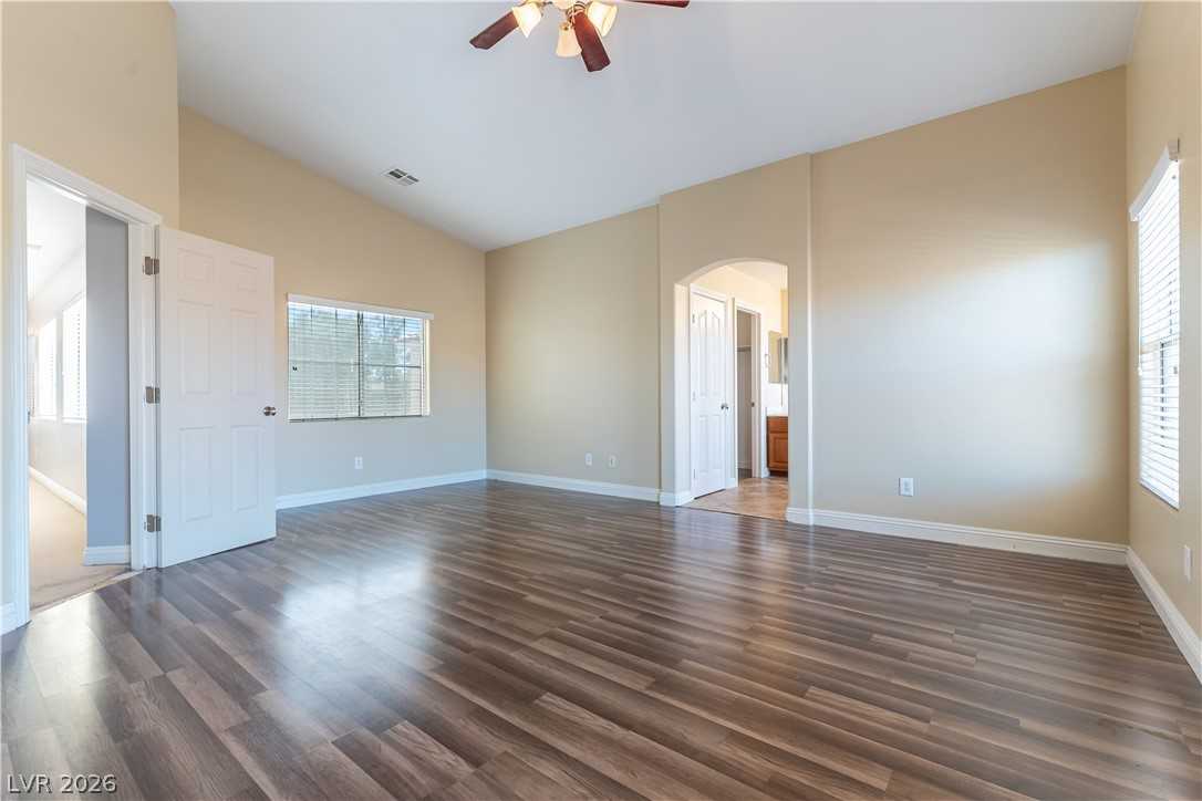 Upstairs bedroom with wood-look flooring at 9010 Mossy Hollow Avenue
