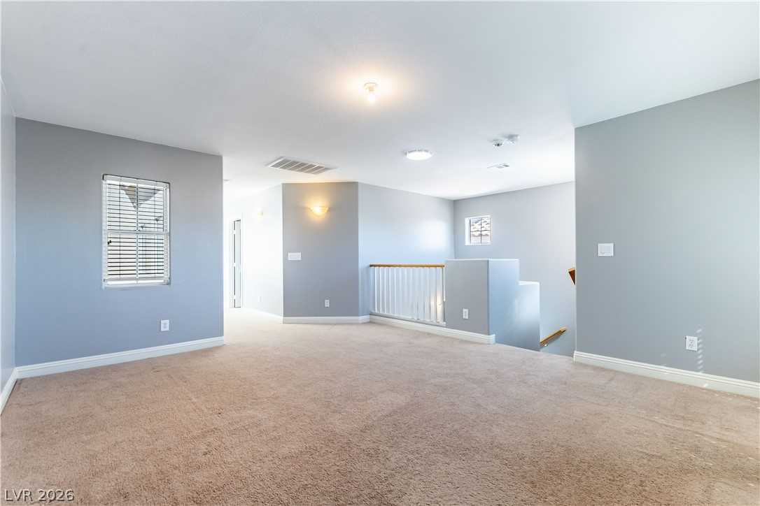 Upstairs open living area at 9010 Mossy Hollow Avenue