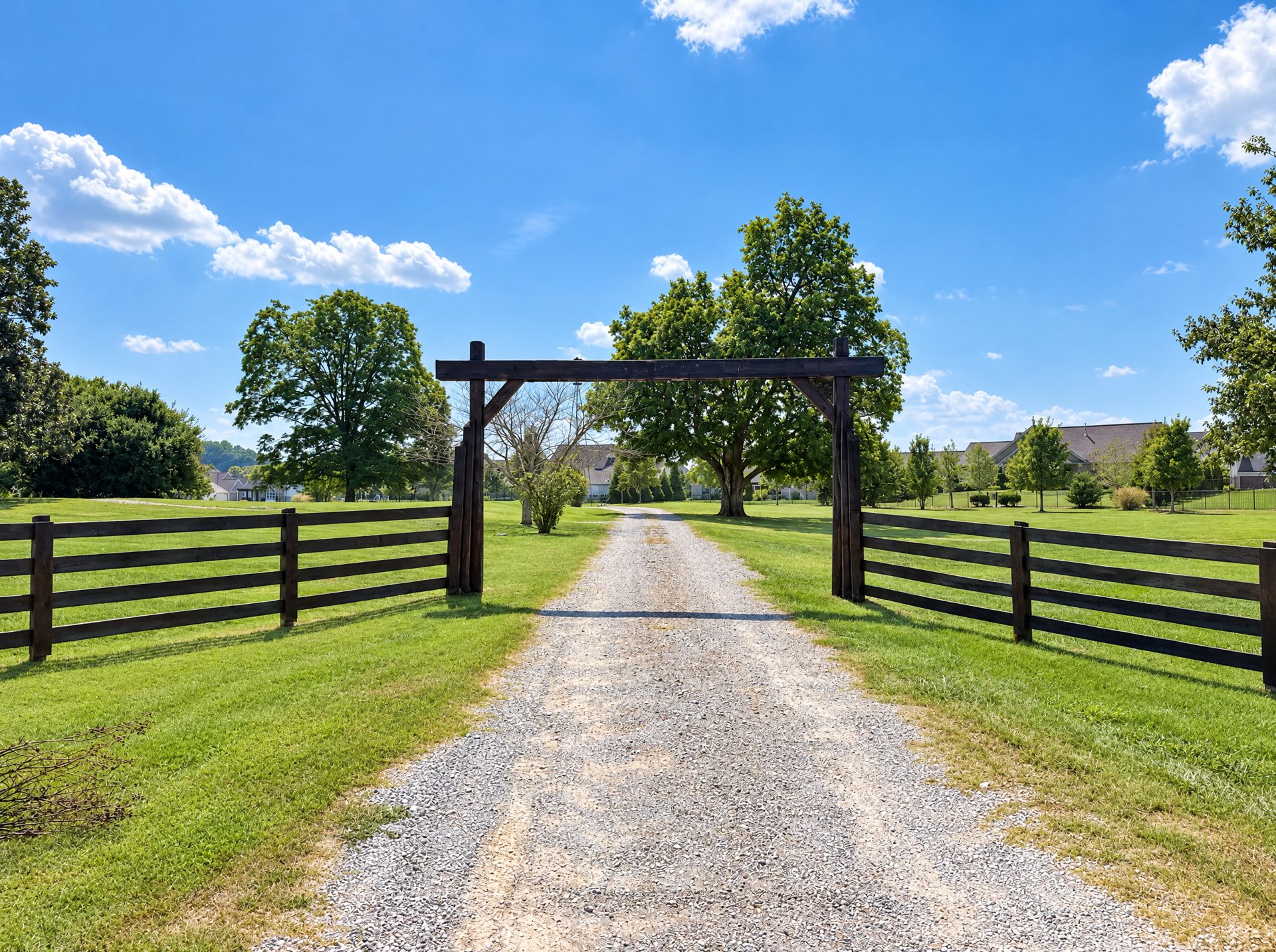 Timber farm gate and gravel drive in College Grove, TN