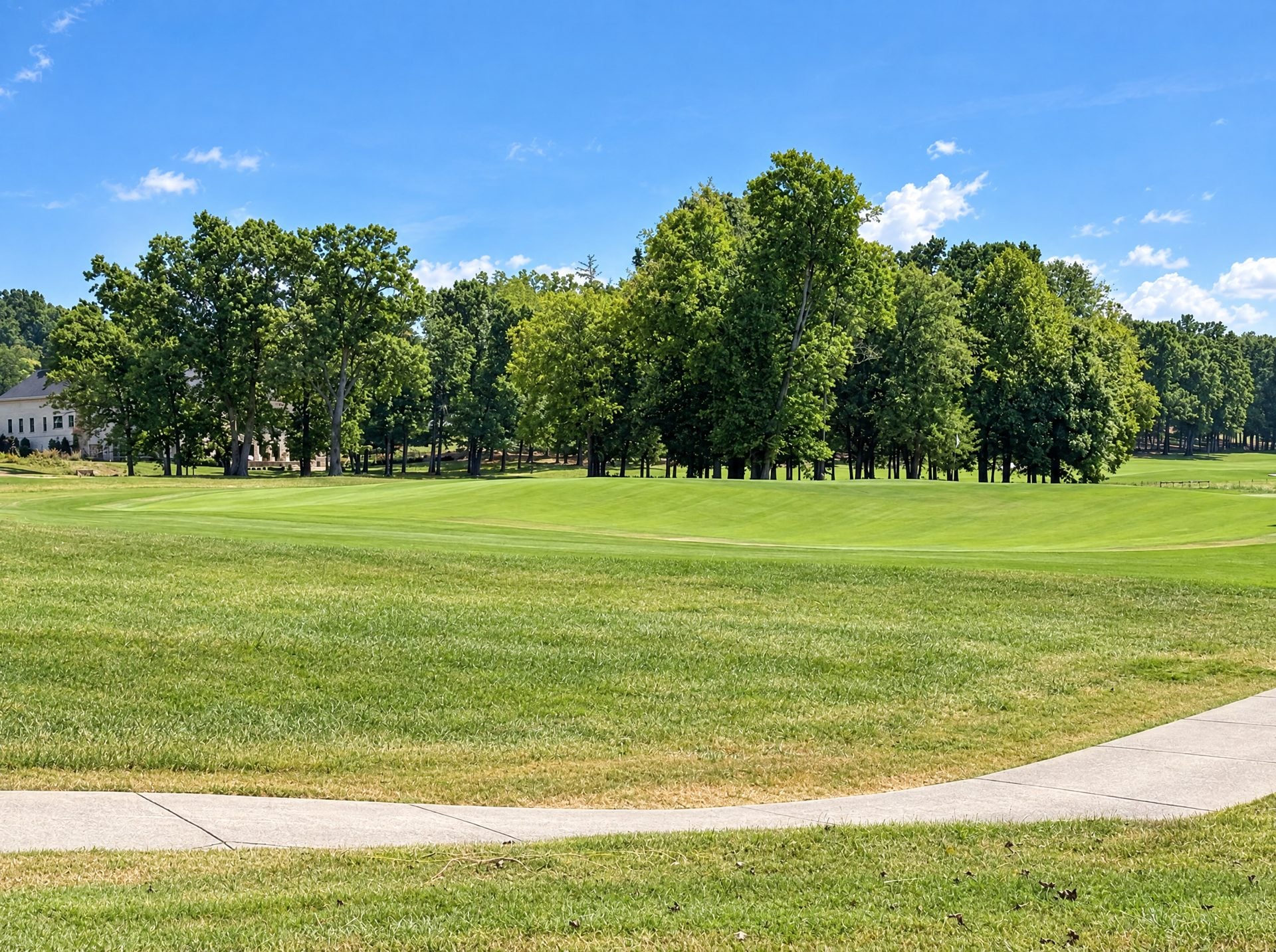 Golf course green and mature trees in College Grove, TN