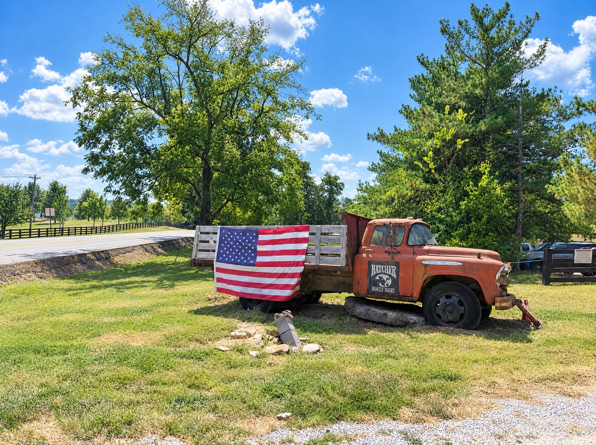 Vintage truck draped with an American flag in College Grove, TN