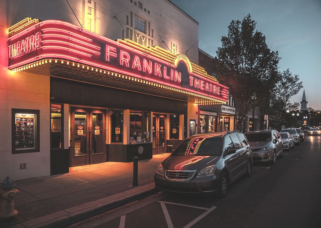The Franklin Theatre marquee lit at dusk on Main Street in Franklin, TN