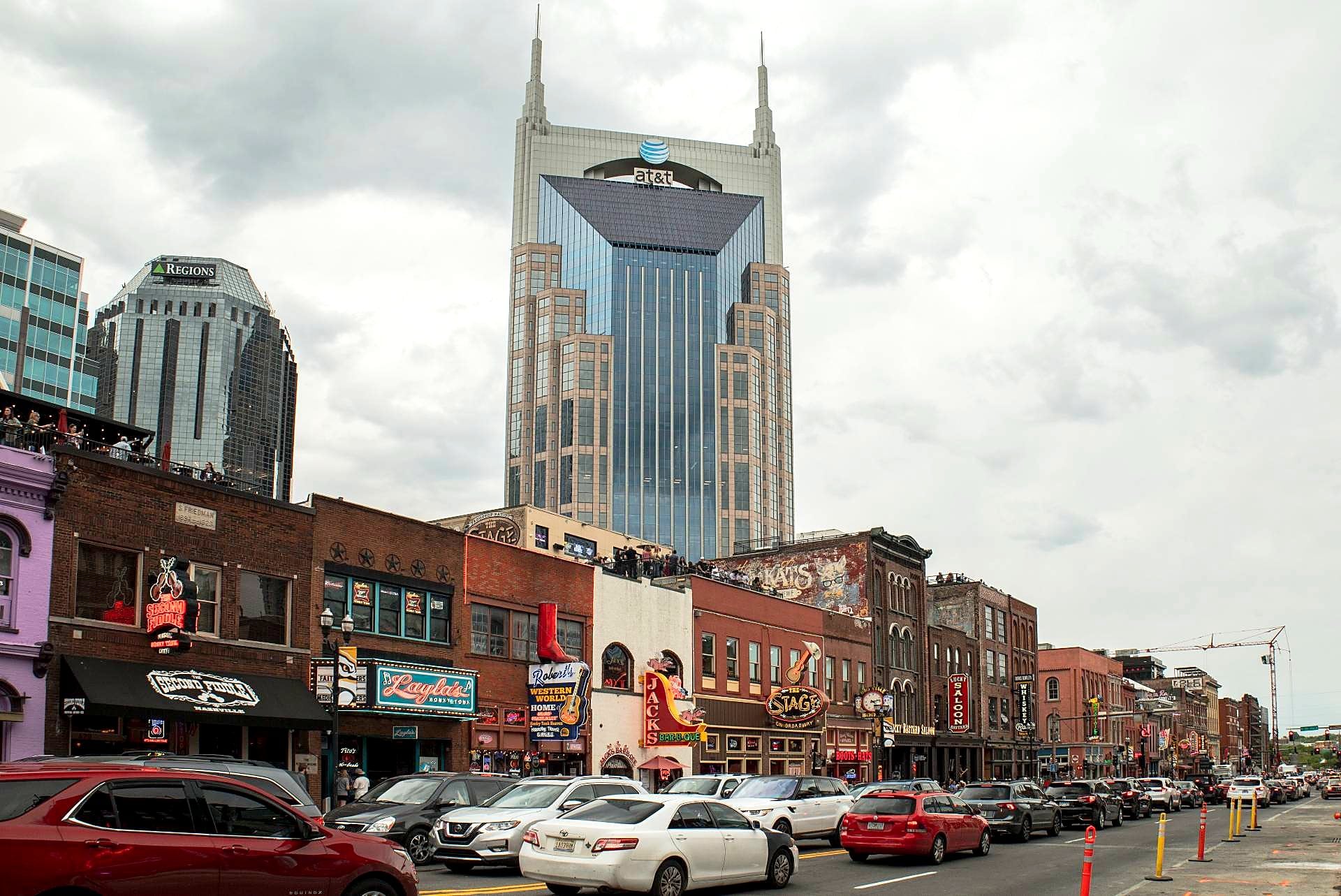 Lower Broadway in downtown Nashville, TN with the skyline behind it