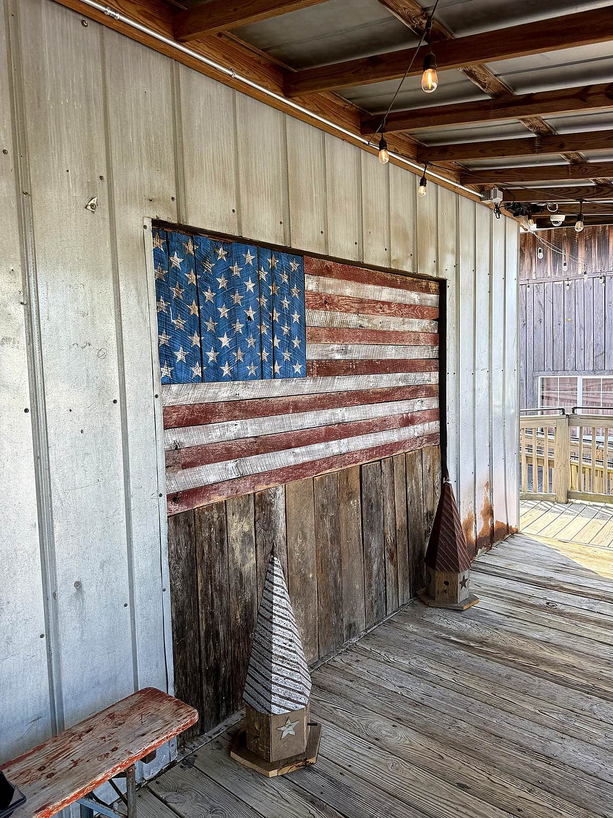 Painted wooden American flag on the porch of the Nolensville Feed Mill in Nolensville, TN