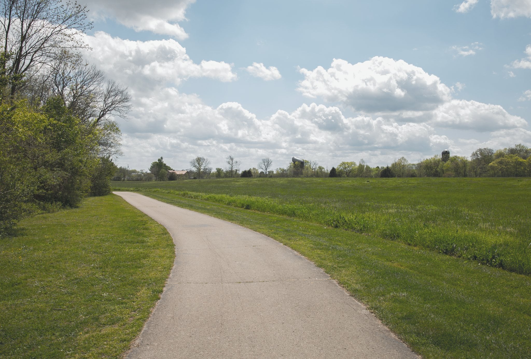 Paved walking path through open fields in Spring Hill, TN