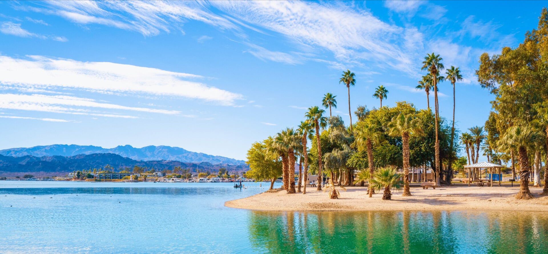 Tranquil lakefront walking trail landscape at Lake Havasu and turquoise-colored water in Havasu City, Arizona