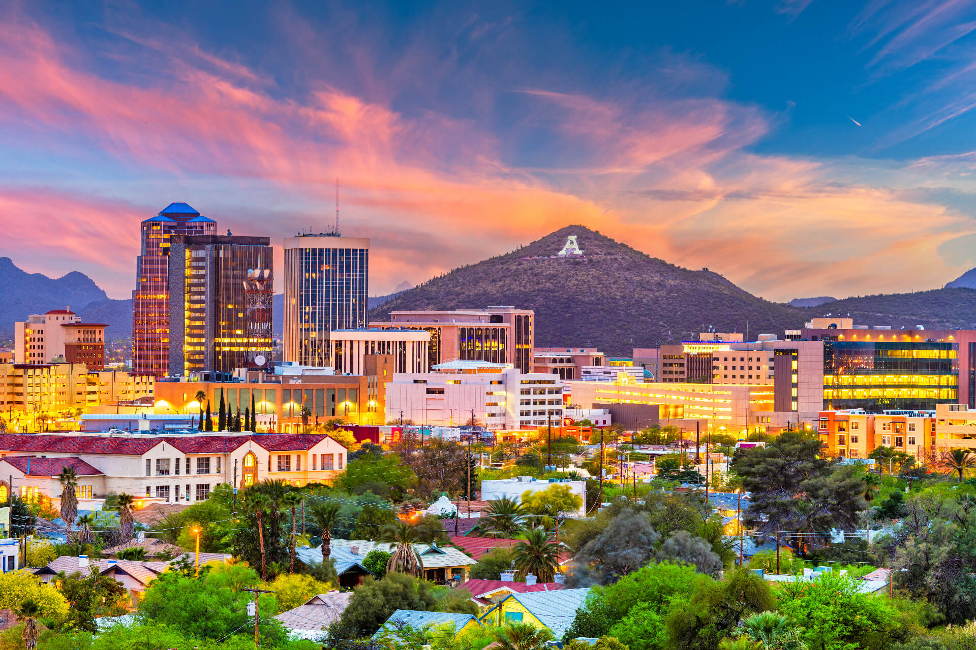 Tucson, Arizona, USA downtown skyline with Sentinel Peak at dusk