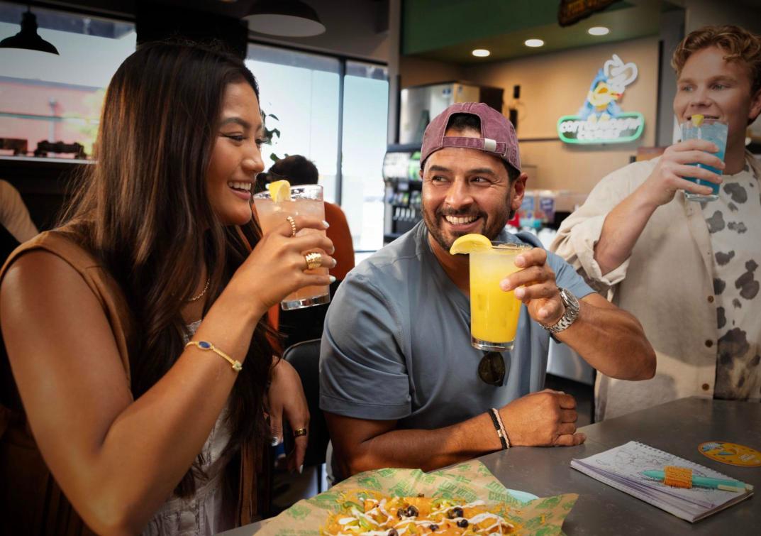 Friends enjoying cocktails at the Cheba Hut full service bar