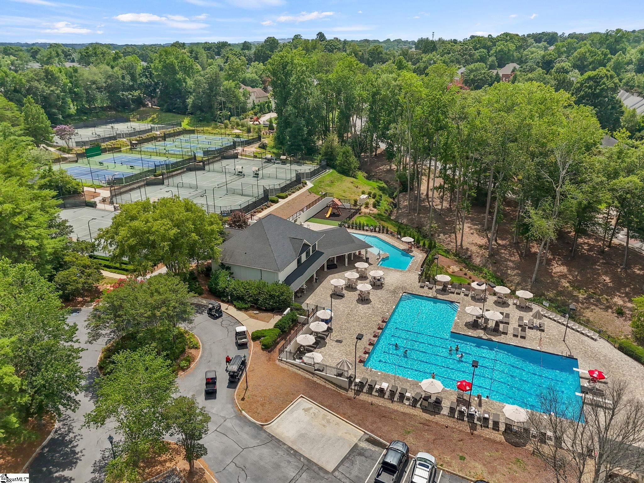 Aerial view of Thornblade amenities, including outdoor swimming pools, tennis courts, a playground, and poolside seating.