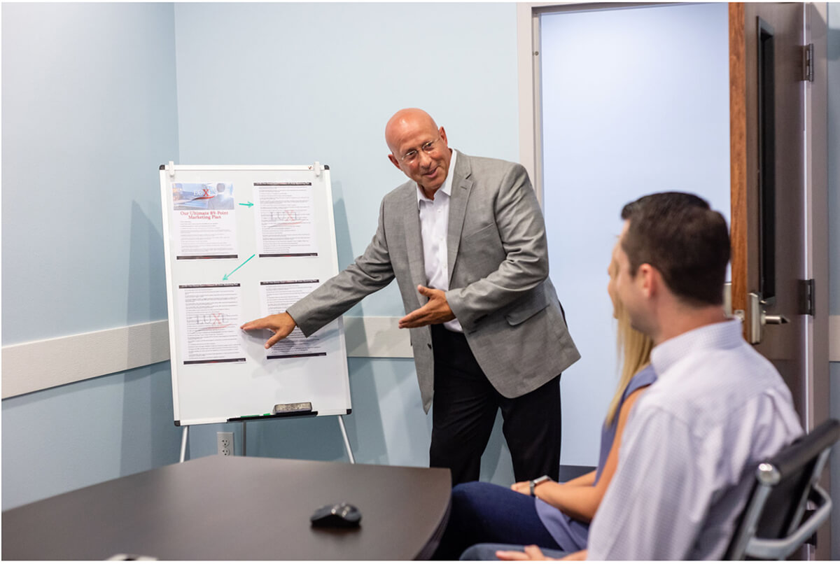 Andy Presenting to clients in office 1 (1)