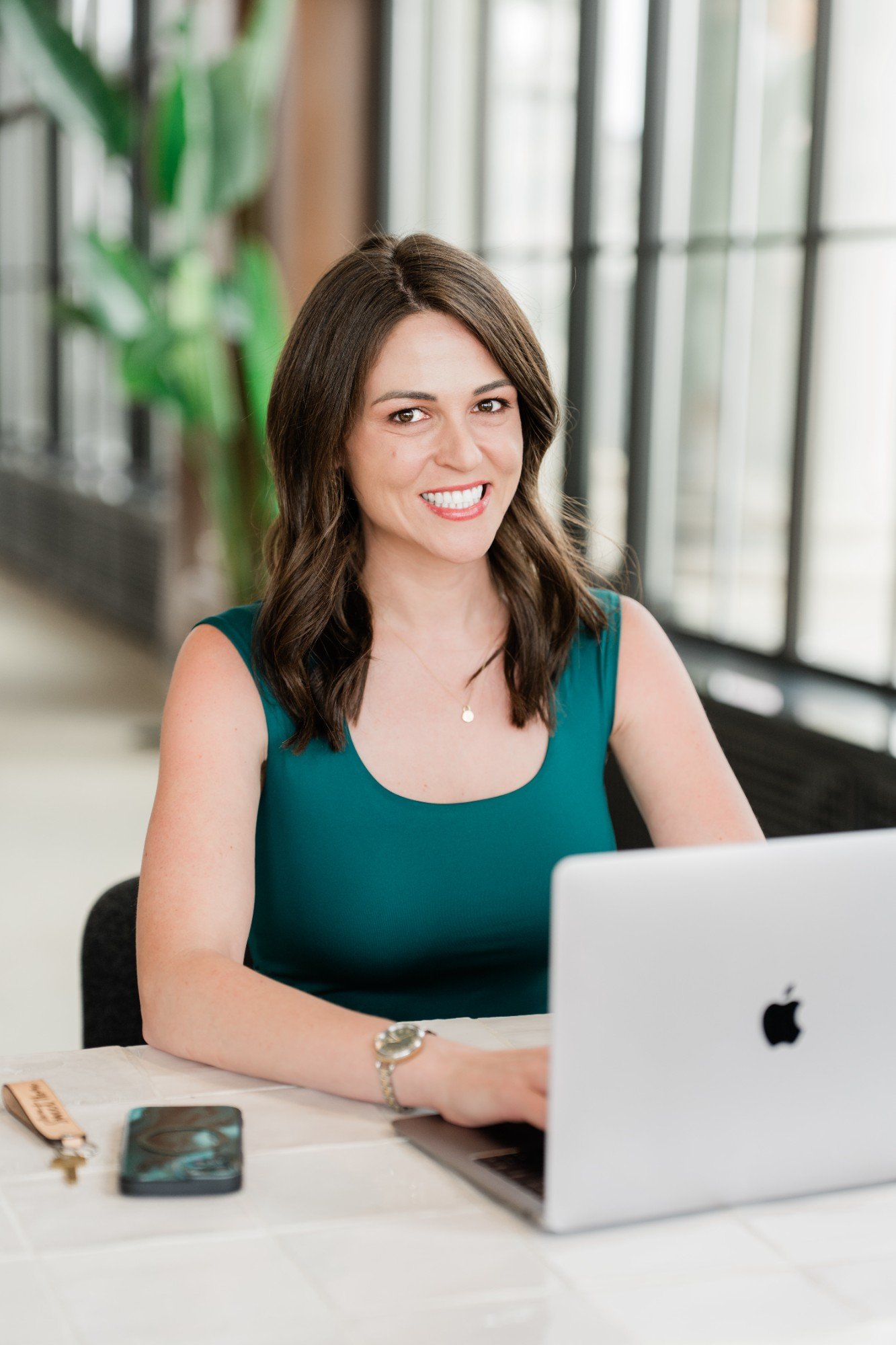 smiling woman using laptop