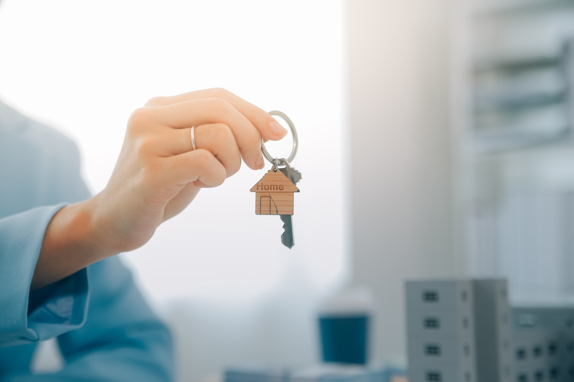 hand holding house key
