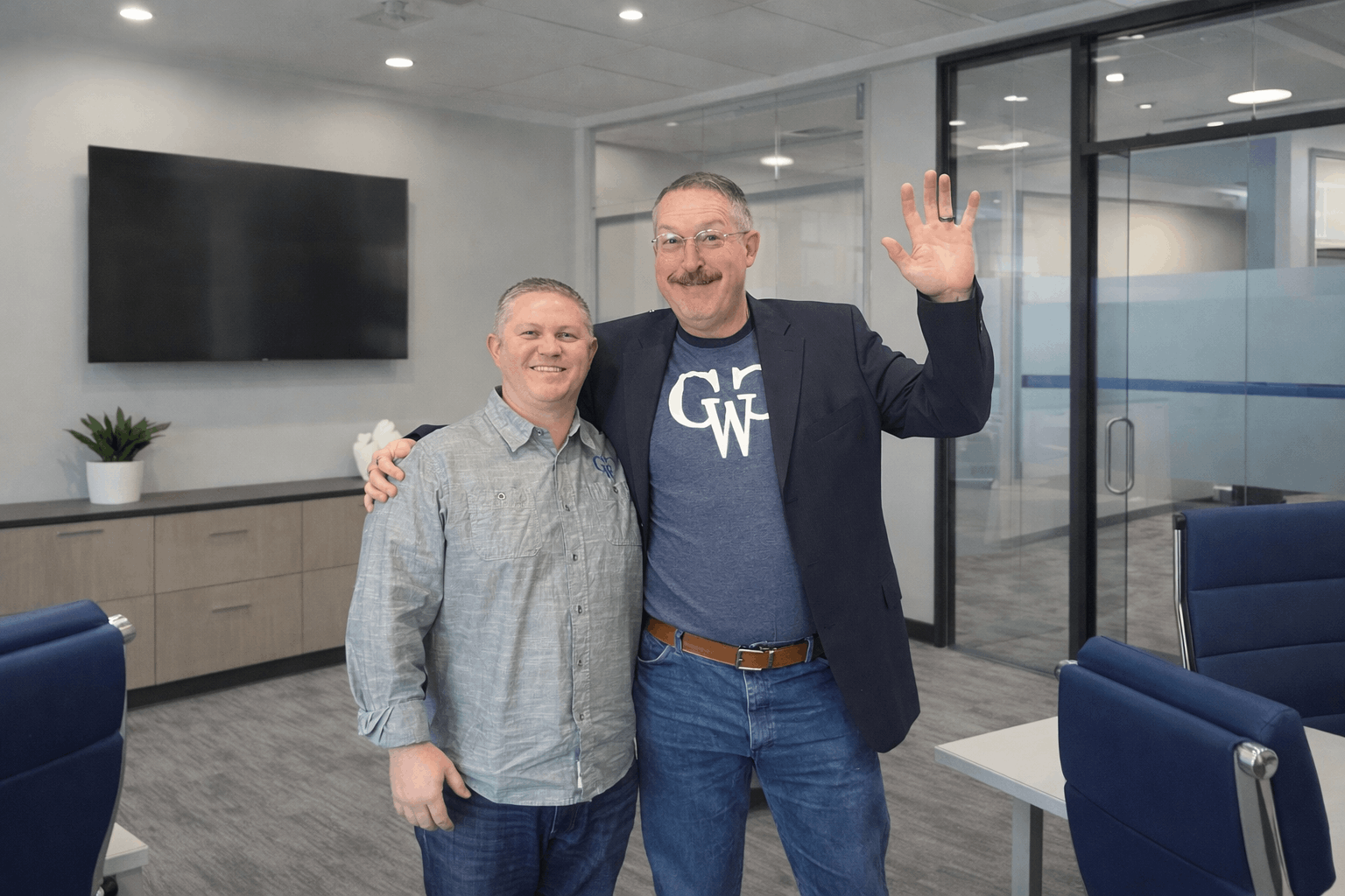 coworkers smiling office meeting