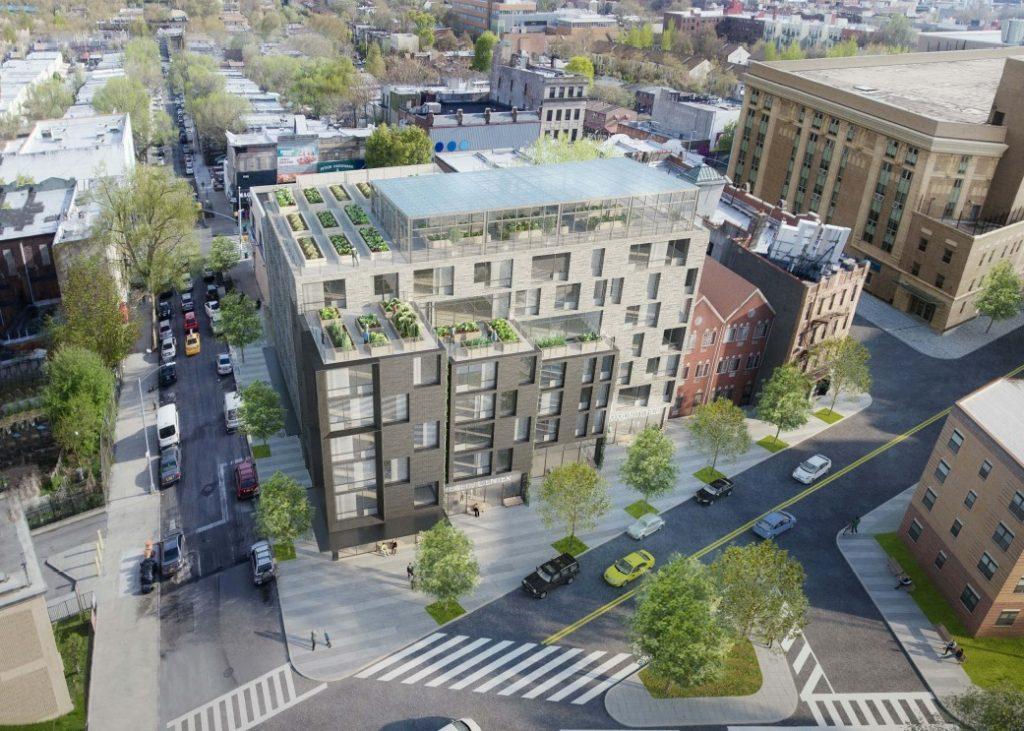 Aerial rendering of new mixed-use building with rooftop greenhouse in East New York