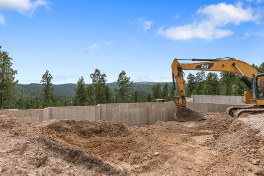 excavator digging building foundation
