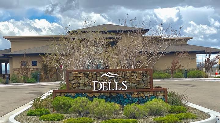 The Dells entry sign and clubhouse at Granite Dells Estates