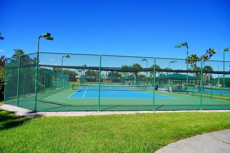 A community tennis court in a sunny day