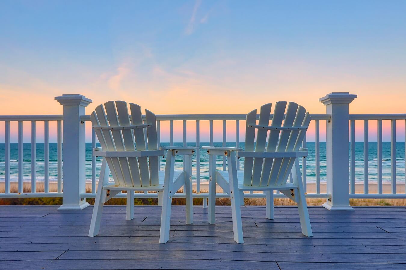 Empty Adirondack chair on a deck balcony