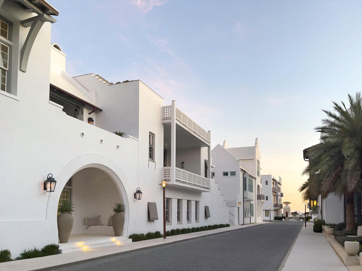 Upscale whitewashed concrete houses along a quiet street