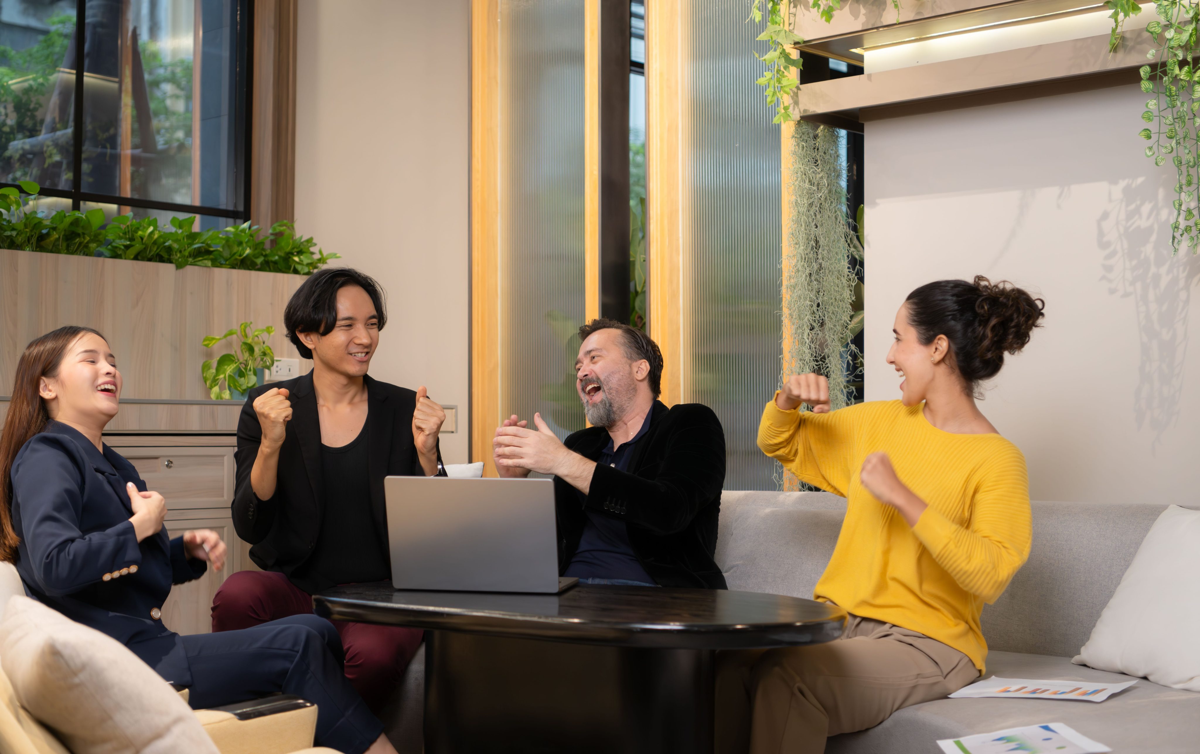 Group of business people discussing business plan at meeting table in office.