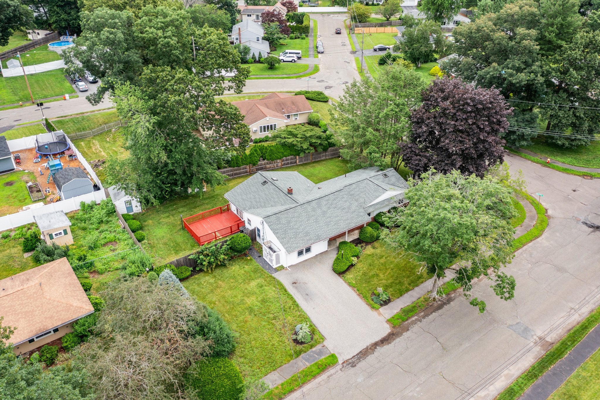Aerial view of a single-family ranch home and yard on the North Shore of Massachusetts
