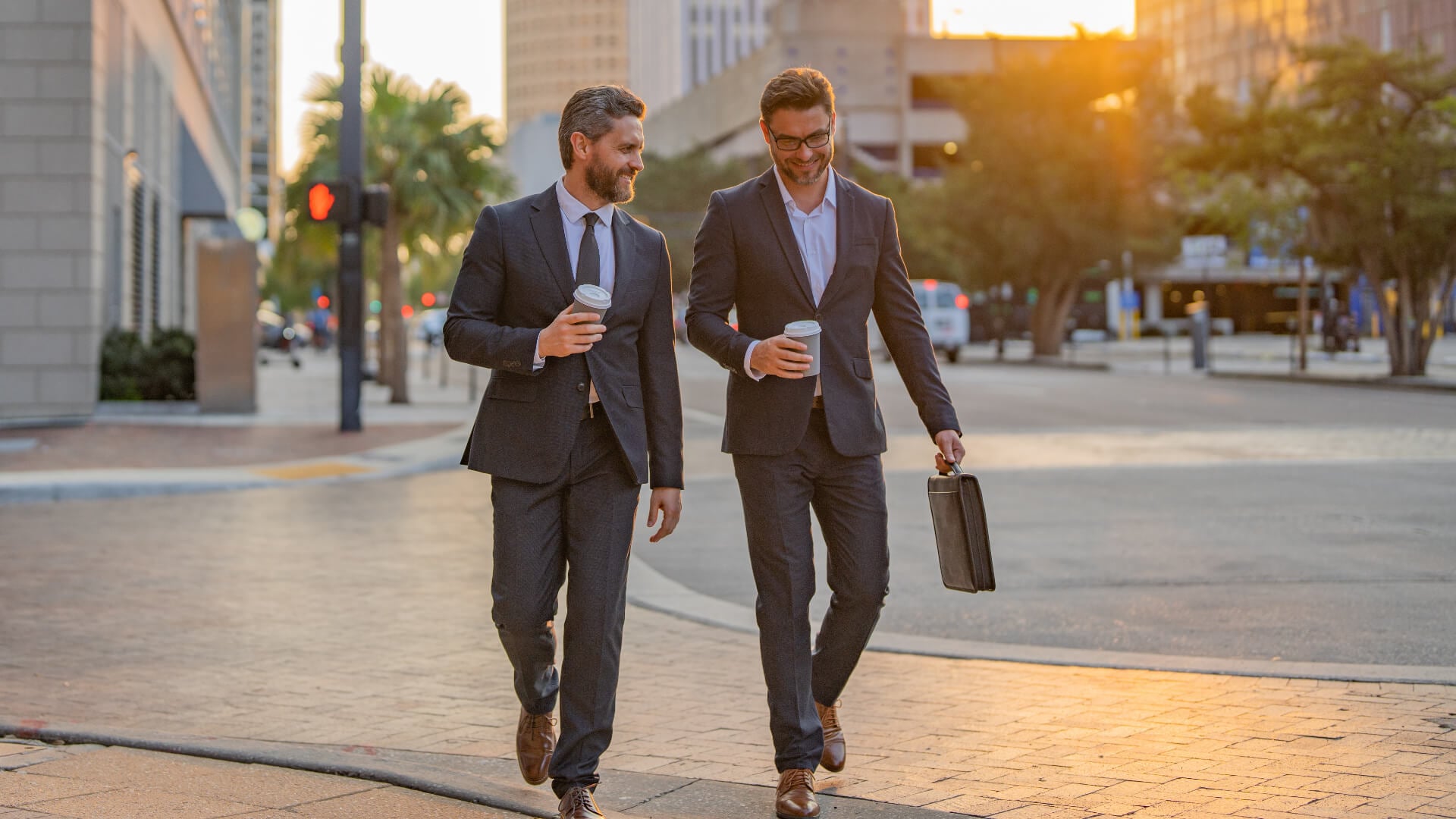 Two businessmen walking and talking at urban city.