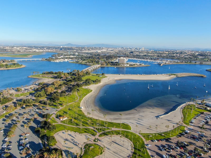 Aerial view of Mission Bay & Beaches in San Diego, California. USA. Community built on a sandbar with villas, sea port. & recreational Mission Bay Park. Californian beach-lifestyle.