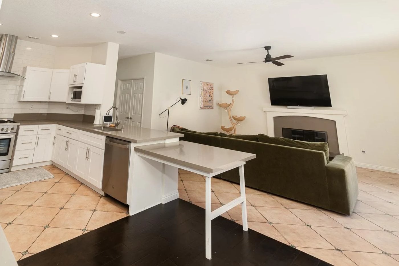 Kitchen and family room with the owners' own furniture