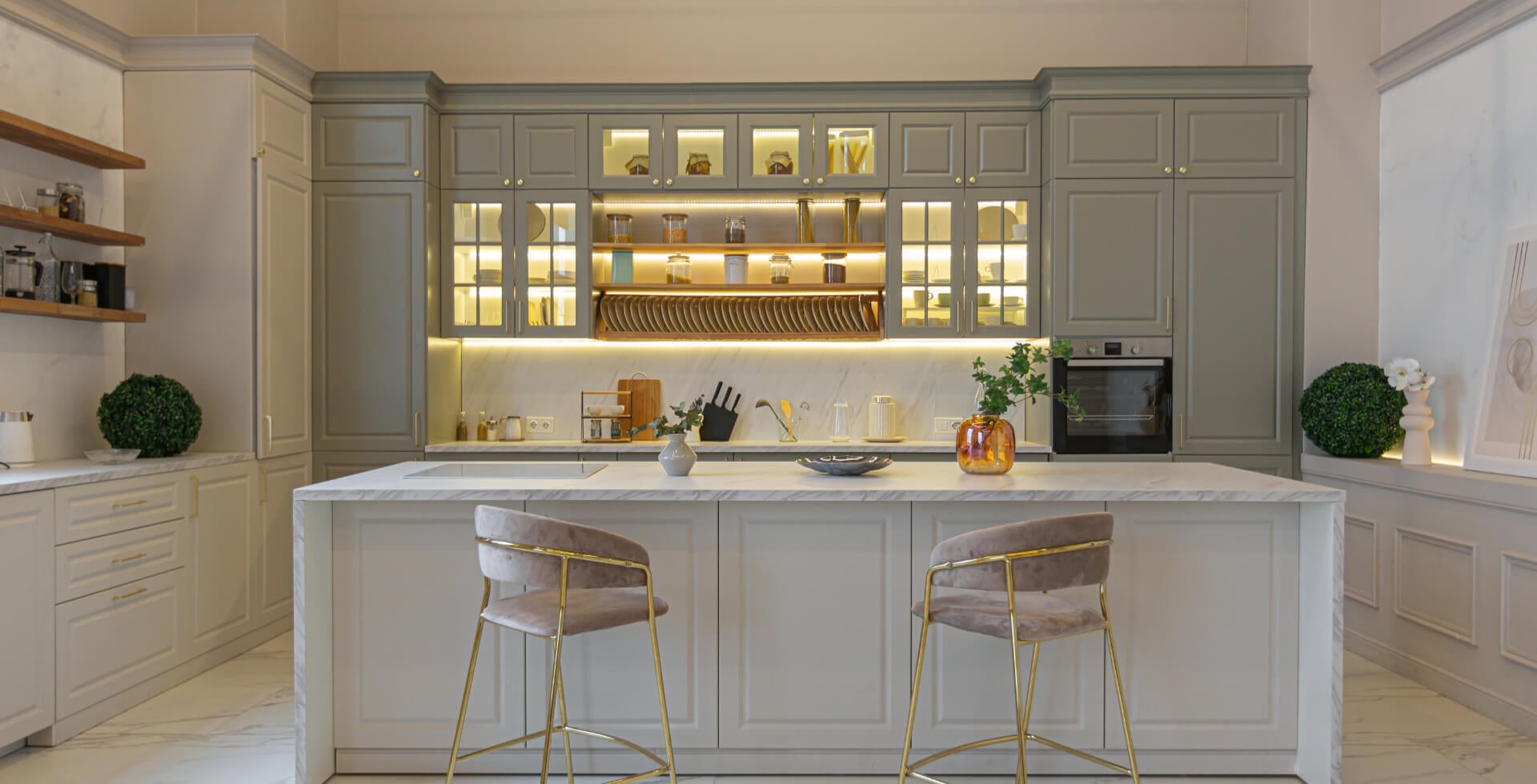 the latest fashion home trends in an ultra modern elegant interior of a cozy studio in soft pastel colors. close-ups of a stylish kitchen with an island for cooking