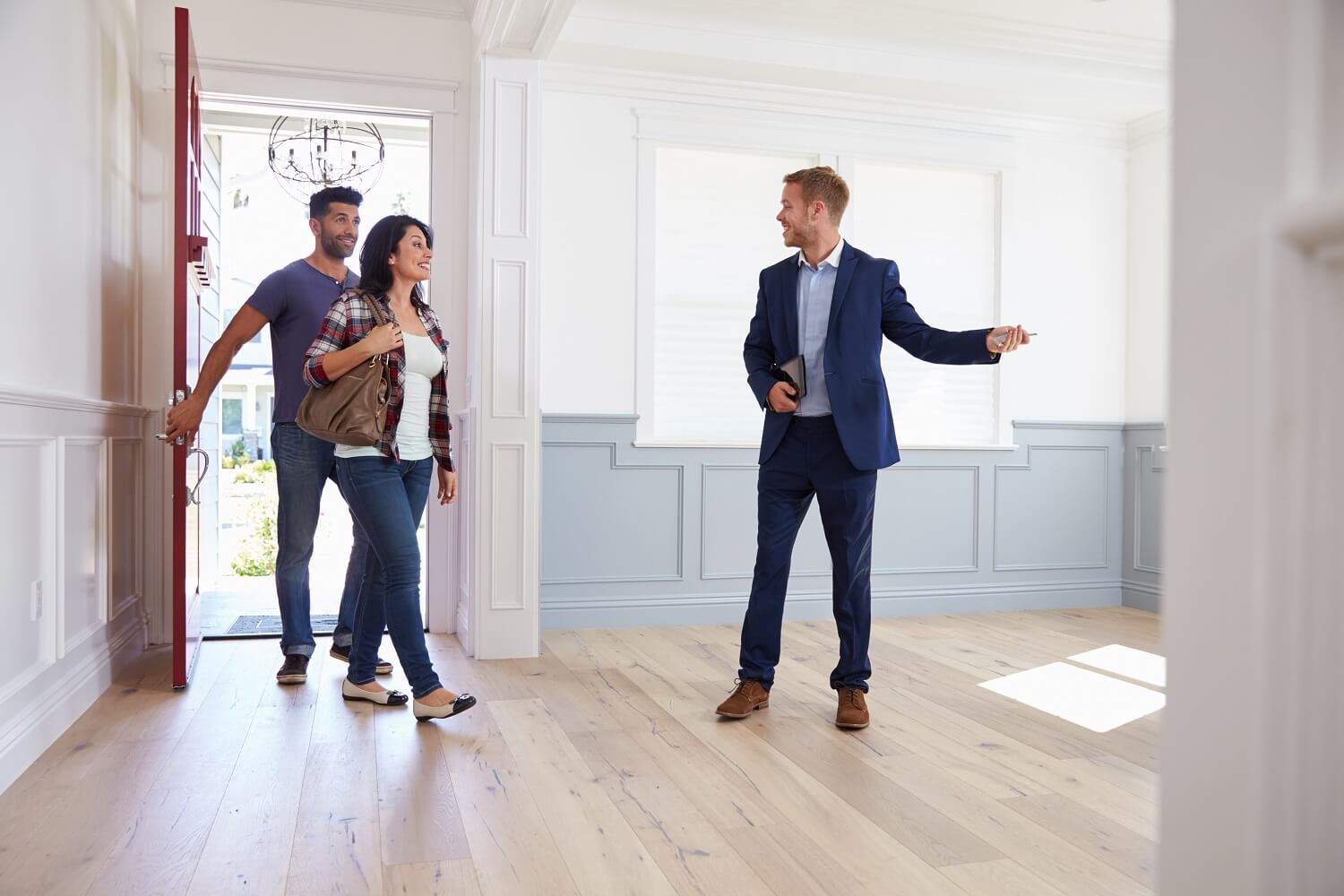 Realtor Showing Couple Around New Home