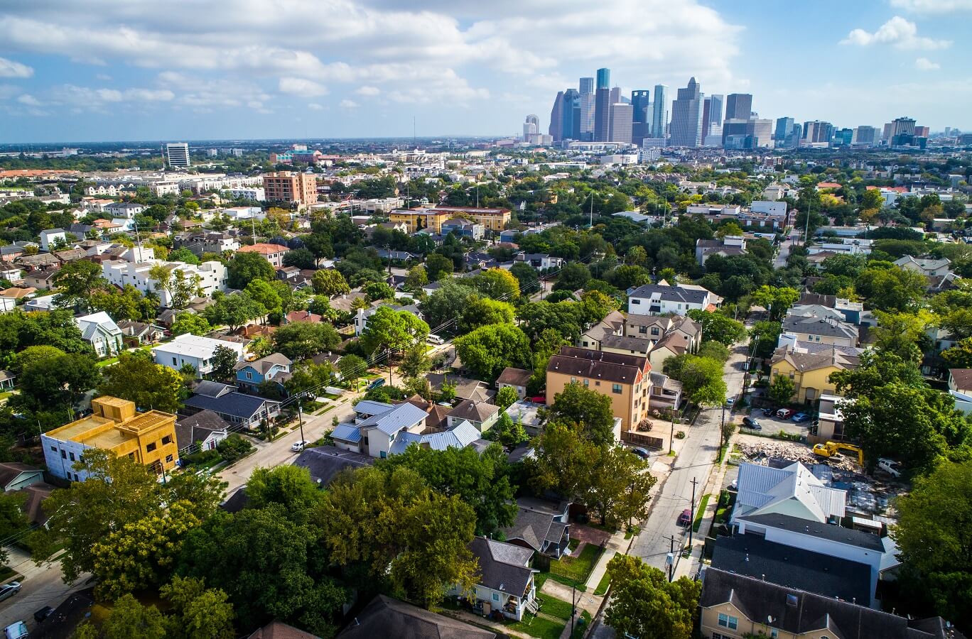 West of downtown suburb near Montrose with the downtown skyline of Houston , Texas in the distance