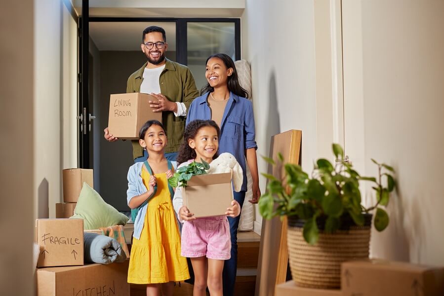 Happy family moving into a new home together