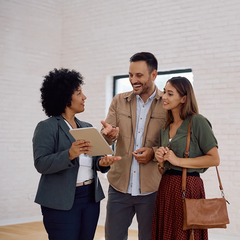 Happy-real-estate-agent-and-her-clients