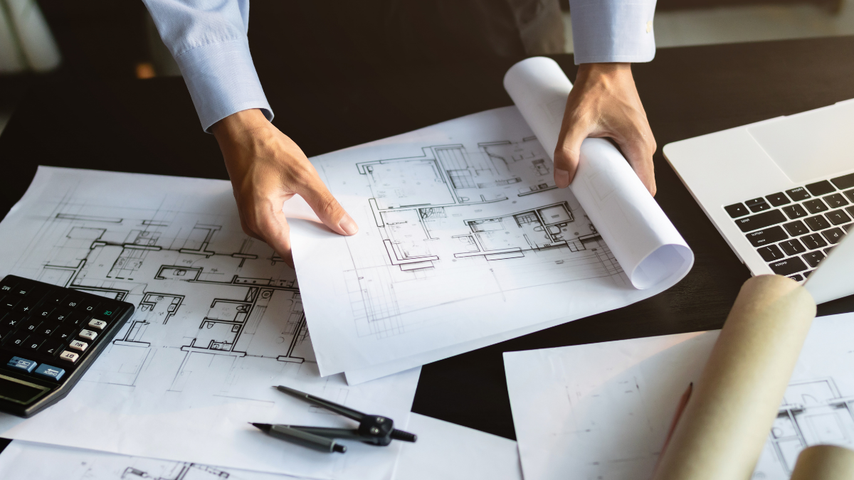 Architectural plans and project documents representing the thoughtful planning and collaboration behind successful South Bay real estate decisions.
