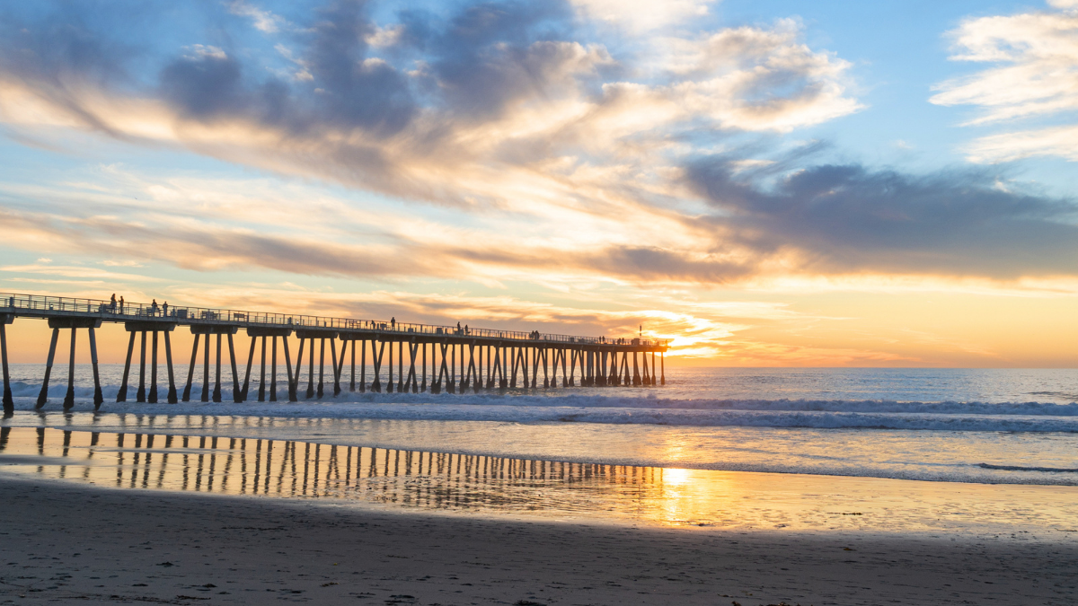 Hermosa Beach Pier at sunrise representing the South Bay lifestyle sought by technology professionals and executives purchasing homes after liquidity events