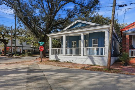 a_crisp_daytime_street_corner_neighborhood_scene_u
