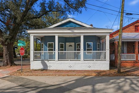 a_sunny_daytime_street_corner_scene_in_a_suburban