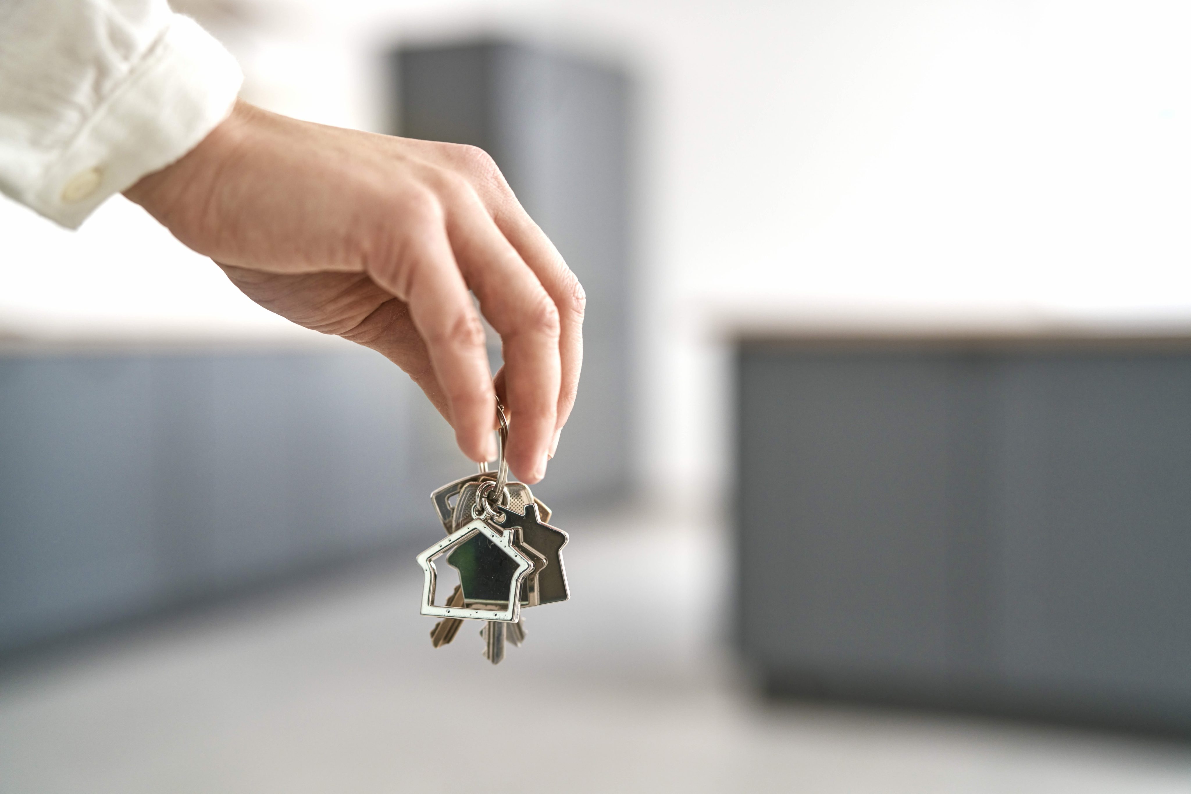 Unrecognizable hand holding  a bunch of keys for new house