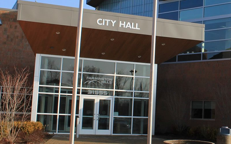 The image shows the entrance to Farmington Hills City Hall in Michigan