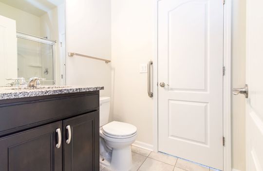 image displays a modern bathroom with several key features toilet with Bidet Seat