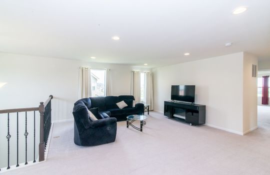 image depicts a living room or lounge area in a residential property