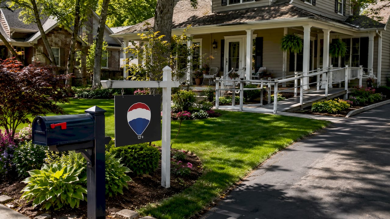 Two-story Michigan home with a covered accessibility ramp and handrails leading to the front porch