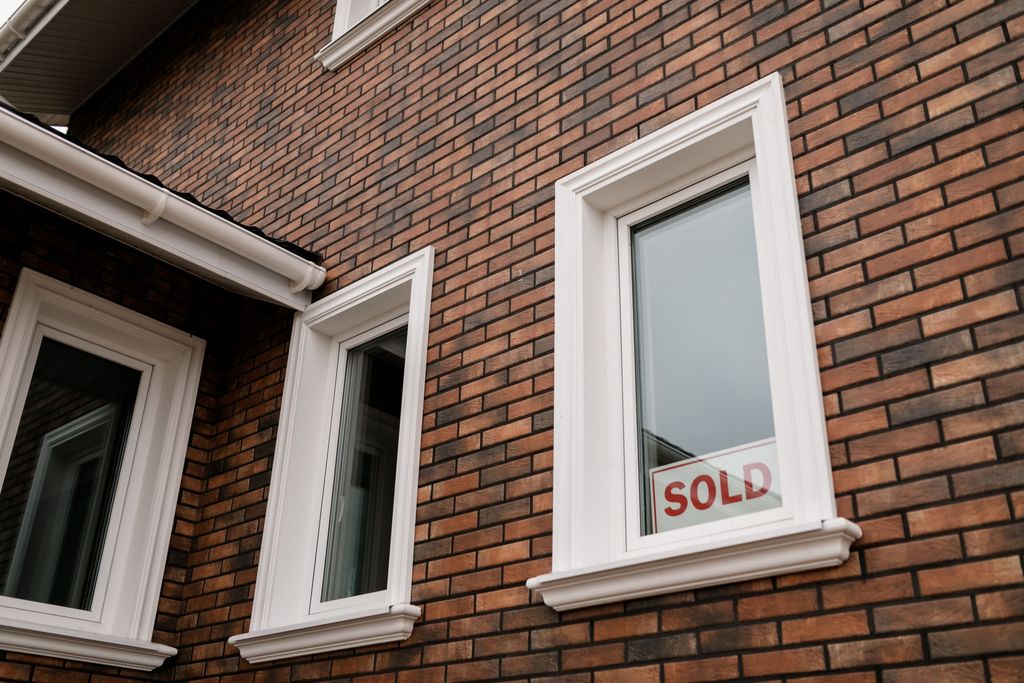 A sold sign in front of a house