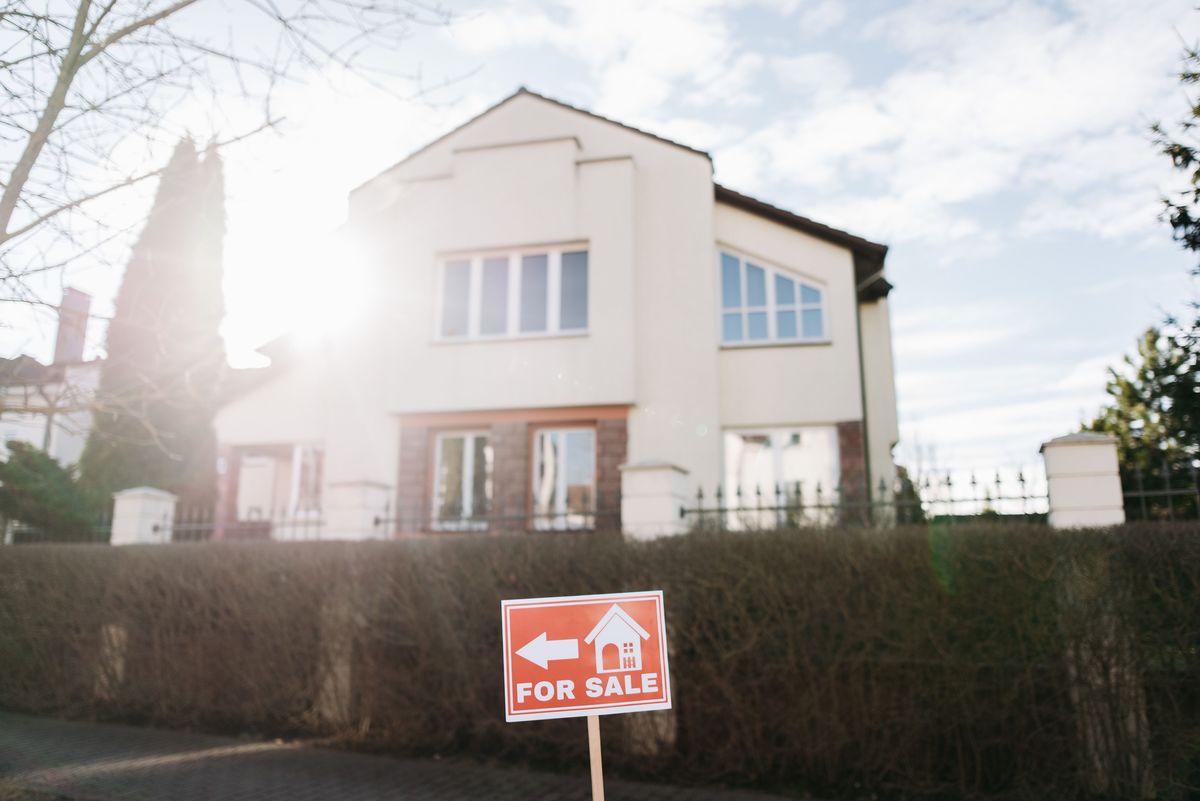 Home with a For Sale sign out front, a reminder to review Mello-Roos and HOA costs before making an offer