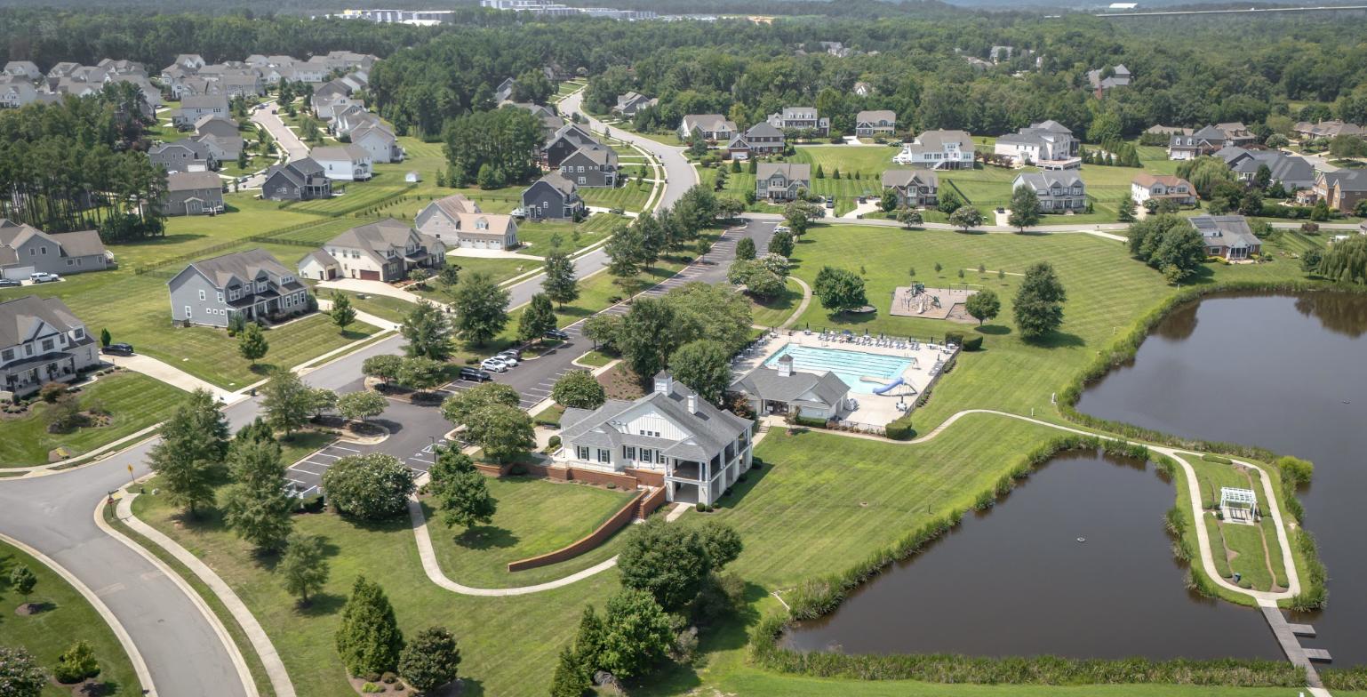 Aerial view of a Chester neighborhood with a clubhouse, pool and lake, Chesterfield County