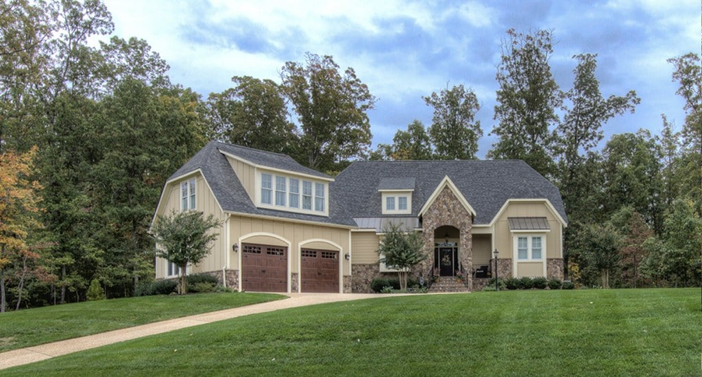 A custom home with stone accents on a wooded lot in Hallsley, Midlothian, Virginia