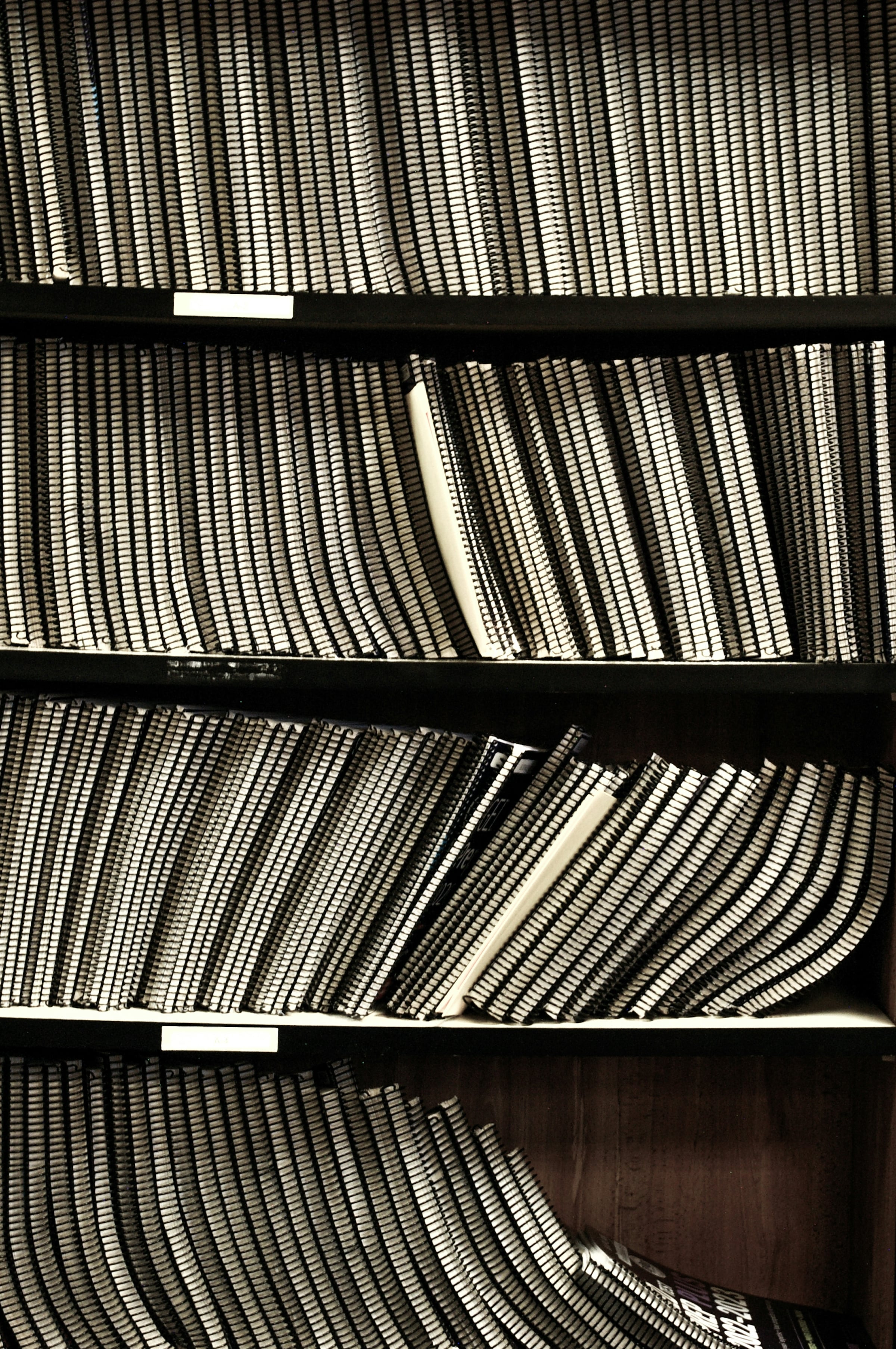 Shelves of bound record volumes filling an archive room
